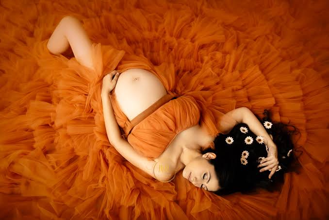 Luxury editorial studio maternity photography - warm light